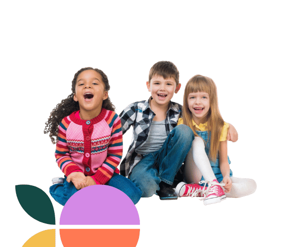 Three children kneeling side by side, all beaming with joy.