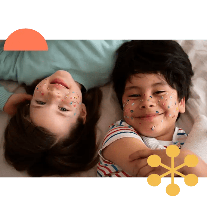 Children enjoying creative play during clinic-based behaviour therapy in Liverpool, promoting emotional expression and social bonding.