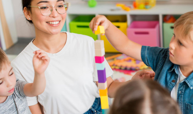 woman-teaching-children-how-play-with-colorful-tower 1 (1)
