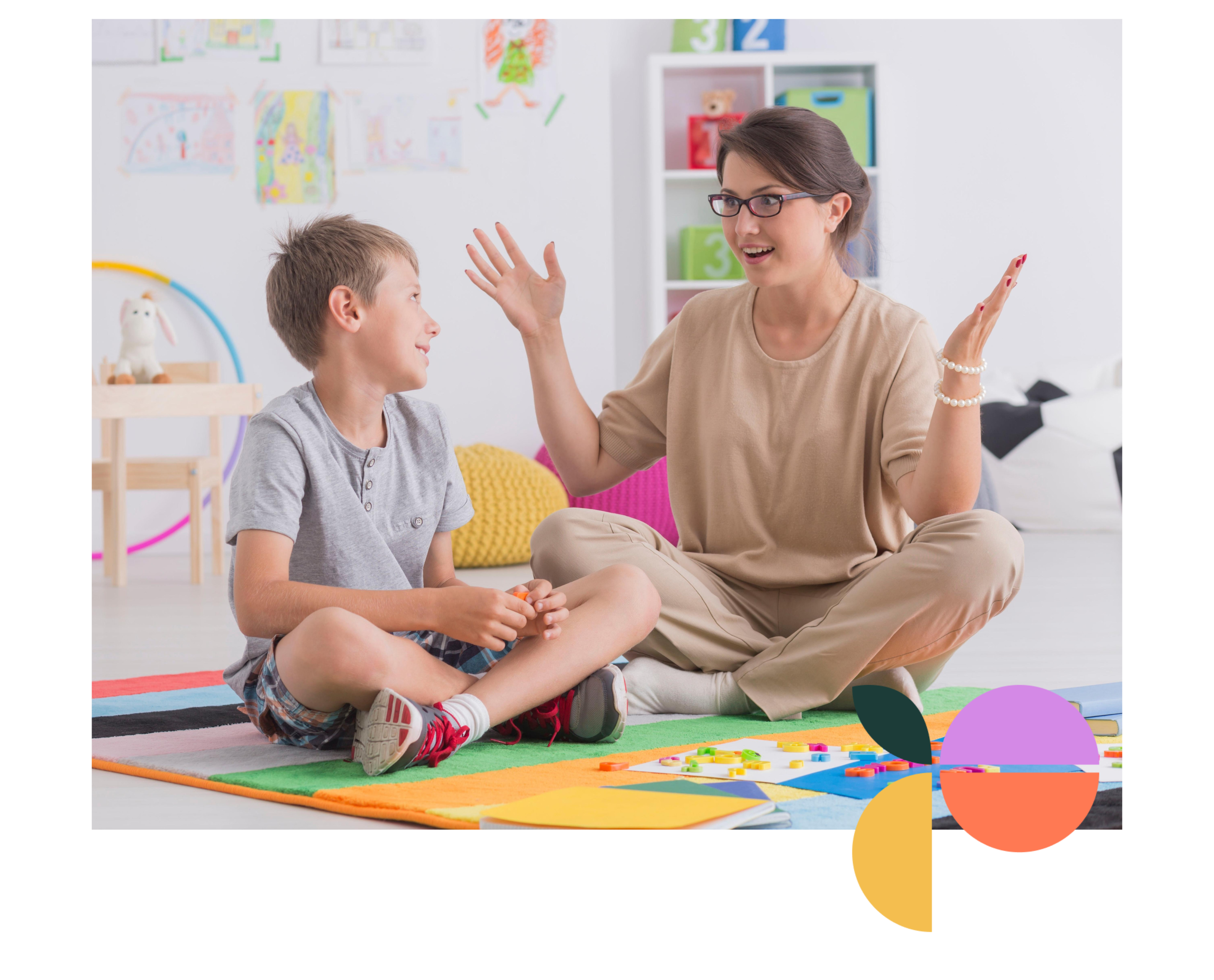 “Behaviour therapist working with support worker to implement a comprehensive behaviour support plan in a school setting.